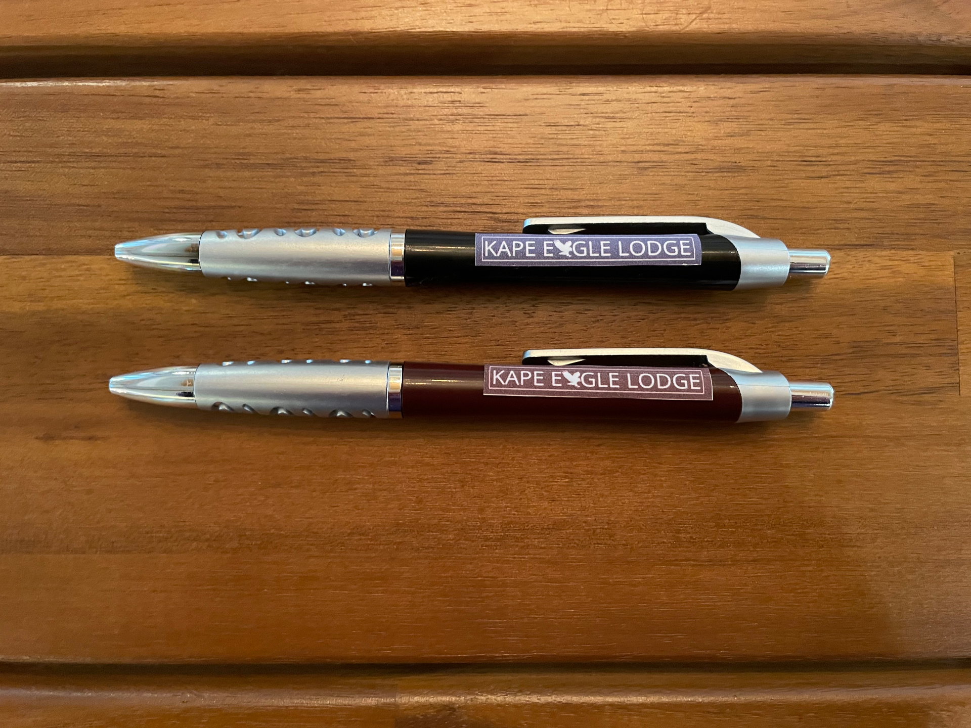 Two Kape Eagle Lodge branded pens