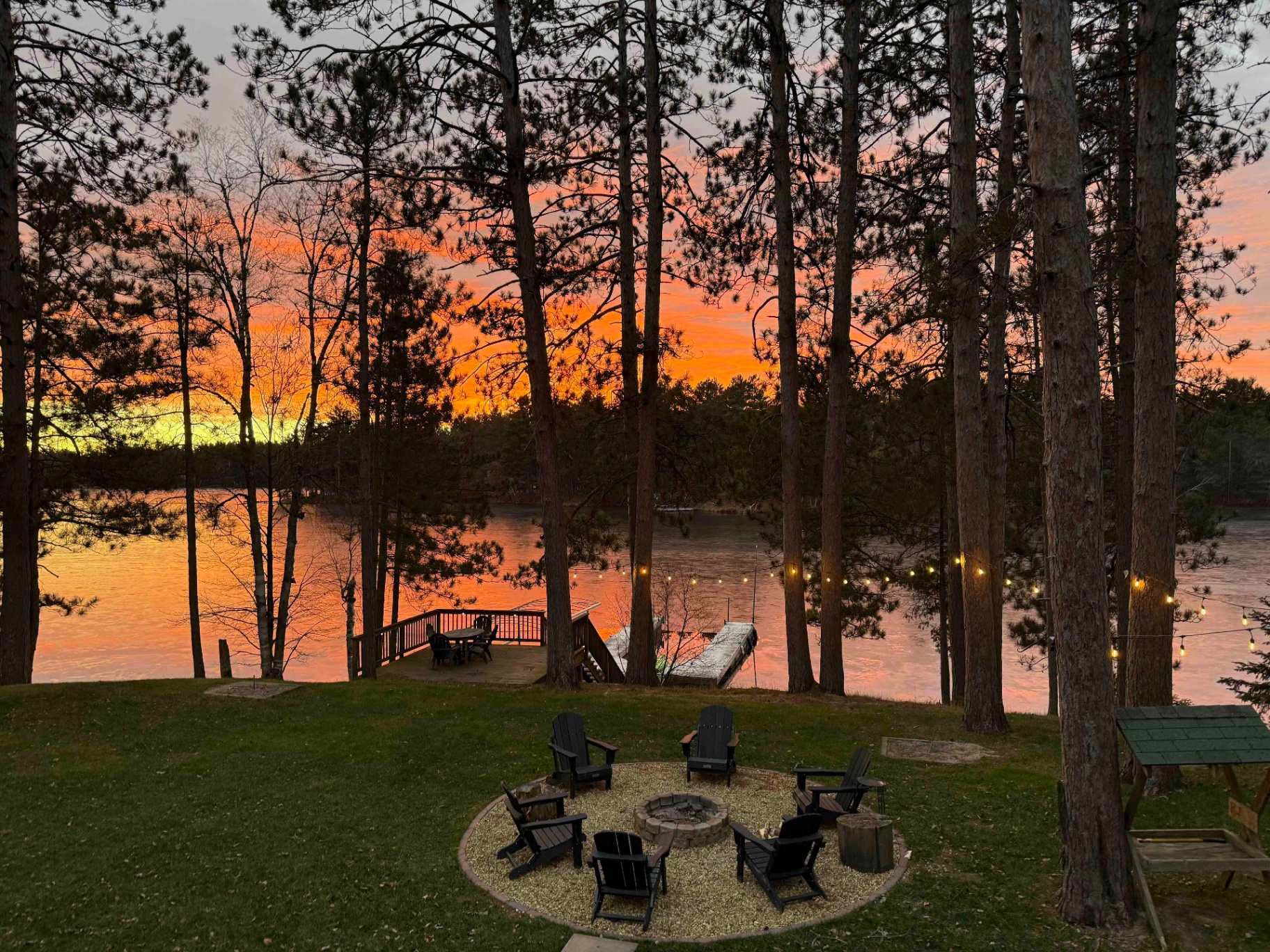 Sunset over the lake from the fire pit and dock