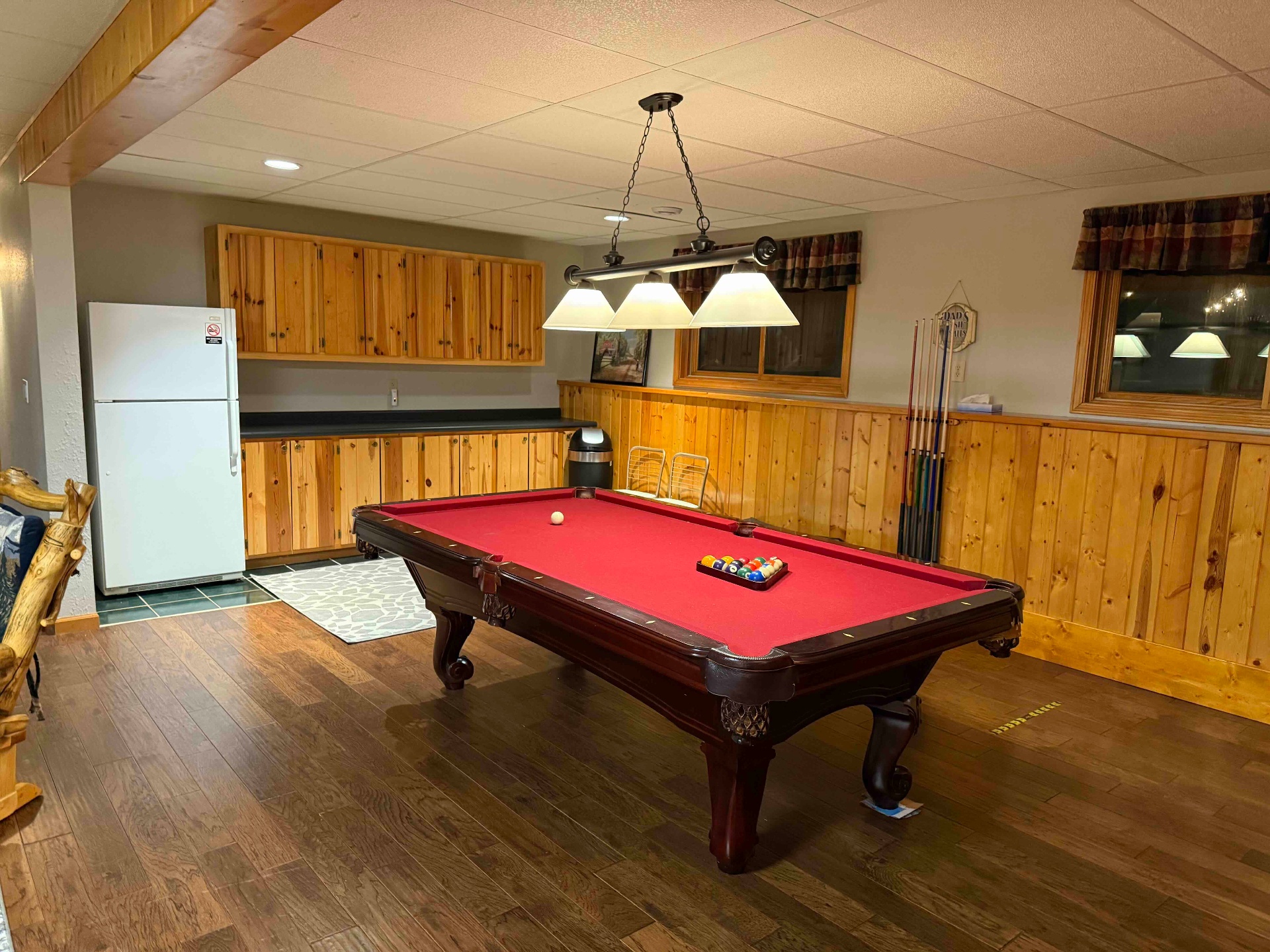Downstairs bar area with pool table and pine cabinets